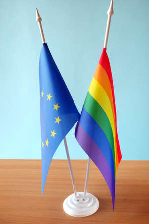 rainbow lgbt flag and European Union flag. homosexual marriage. Same-sex marriage is allowed in European countries Concept. close upの写真素材