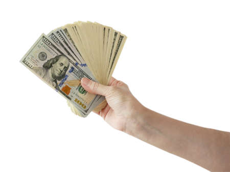 hand holding big stack of dollar money isolated on white background. dollar cash closeup