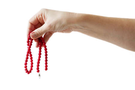 Woman hand holding vintage bracelet with red stones isolated on white background, mock up design, closeupの写真素材