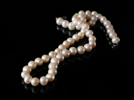 beautiful pearls necklace on black background, pawnshop concept, jewerly shop concept, closeupの写真素材