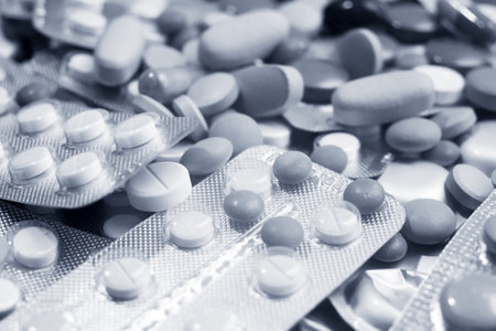 large group of assorted capsules, pills, tablets and blisters, background, toned image, closeupの写真素材