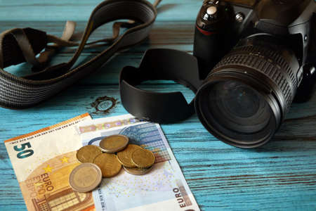 digital photo and video camera and money, store selling photographic equipment, pawnshop, closeupの写真素材