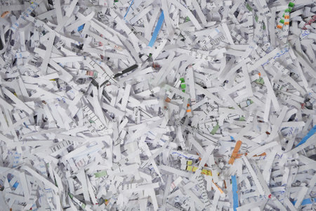 Heap of white shredded papers background. top view