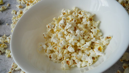 Homemade Cheese Popcorn, Sweet popcorn in white bowls, top viewの写真素材