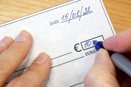 Sign a bank check, Blank bank check, Prepare writing a check, closeup, top viewの写真素材