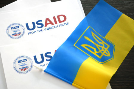 Kiev, Ukraine - 02 12 2023: USAid  and ukrainian flag, USAid is USA agency for international development - assistance abroadのeditorial素材