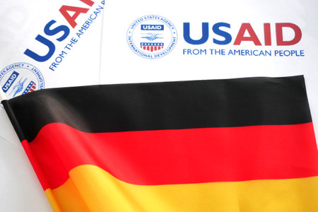 Kiev, Ukraine - 02 12 2023: USAid logo and Germany flag, USAid is USA agency for international development - assistance abroadのeditorial素材