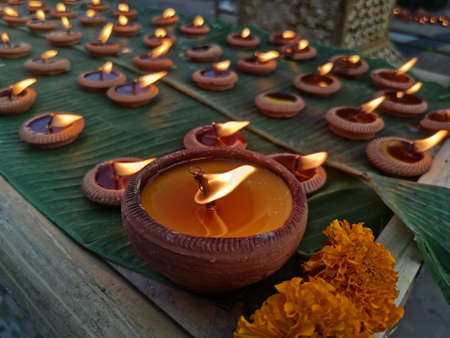 Festival of candles paraded on banana leavesの写真素材