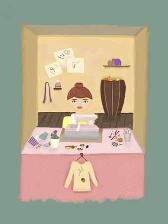 Girl is sewing sweaterの写真素材