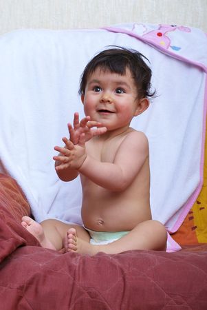Little Baby clapping after bathの写真素材