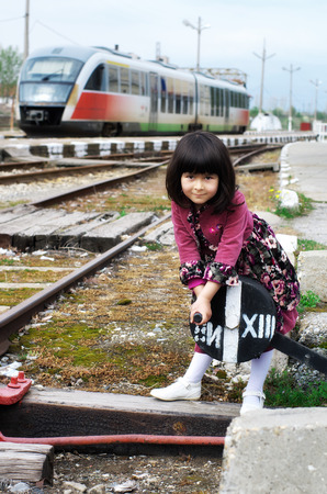 Little girl on a train stationの写真素材