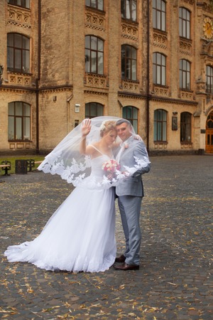 Newlyweds on a walk in the summer day weddingの写真素材