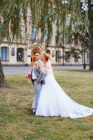 Newlyweds on a walk in the summer day weddingの写真素材