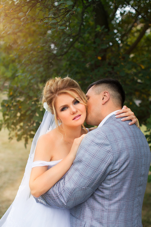 Newlyweds on a walk in the summer day weddingの写真素材