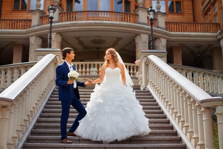Newlyweds on a walk in the park on a warm sunny dayの写真素材