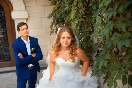 Newlyweds on a walk in the park on a warm sunny dayの写真素材