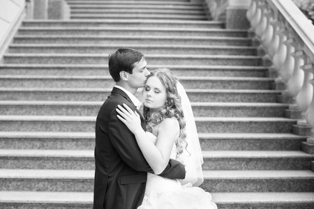 Newlyweds on a walk in the park on a warm sunny dayの写真素材