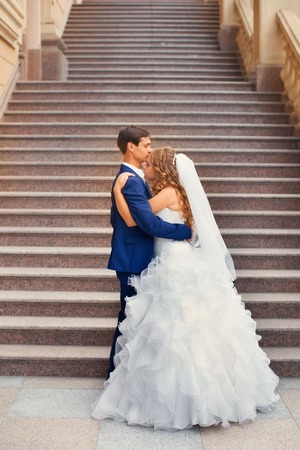 Newlyweds on a walk in the park on a warm sunny dayの写真素材