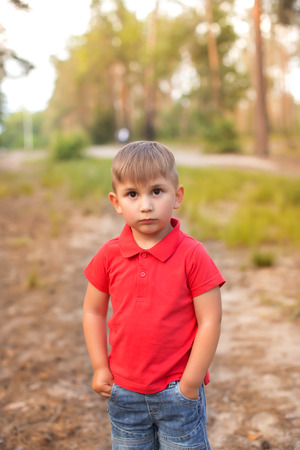 A cute boy in a summer parkの写真素材