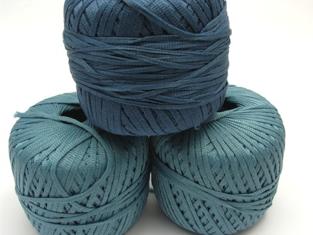 Three stapled  blue wool balls for needleworkの写真素材