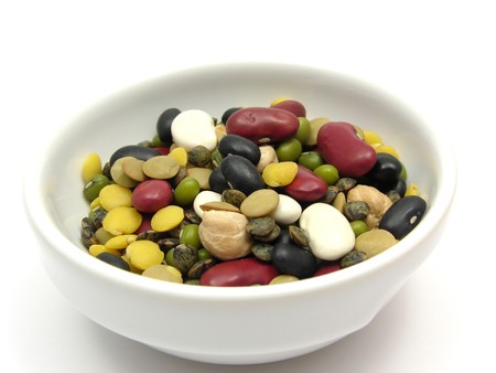A close-up view on mixed and colourful legumes in a bowl of chinaware