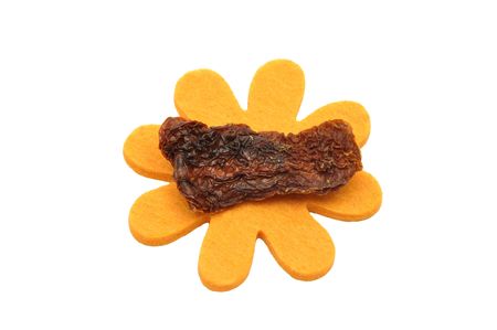 Dried tomatoes and felt decorationの写真素材