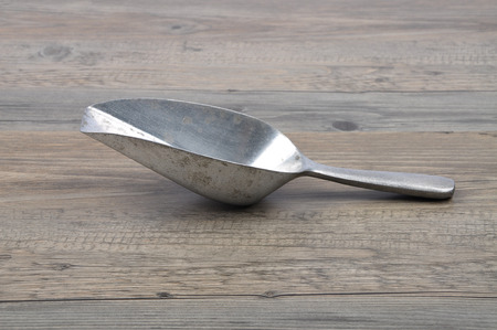 Measuring shovel on woodの写真素材