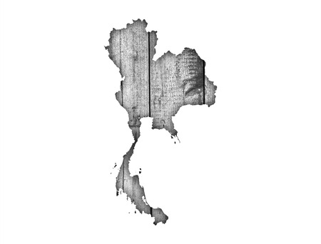 Map of Thailand on weathered woodの写真素材