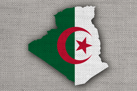 Map and flag of Algeria on old linenの写真素材