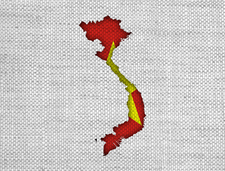 Map and flag of Vietnam on old linenの写真素材