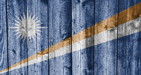 Flag of the Mashall Islands on weathered woodの写真素材