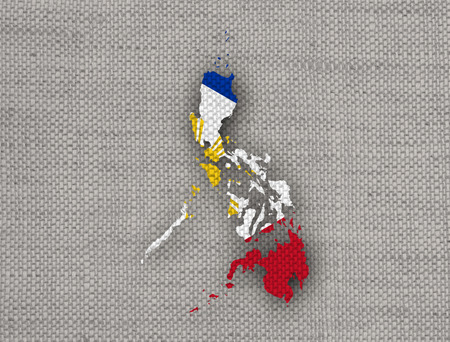 Map and flag of the Philippines on old linenの写真素材