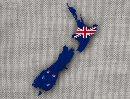 Map and flag of New Zealand on linenの写真素材