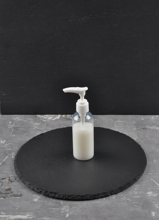 Cosmetic product on concreteの写真素材