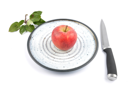 Apple on plate and whiteの写真素材