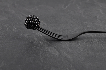Blackberry on fork and shaleの写真素材