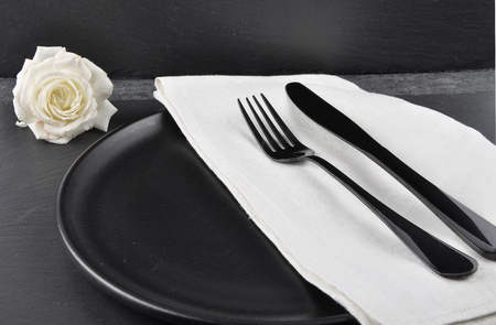 White rose and table setting on slateの写真素材