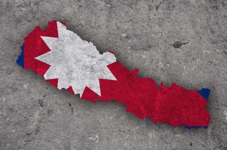 Map and flag of Nepal on weathered concrete