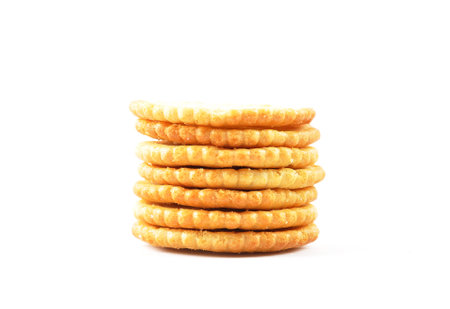 Salty crackers stacked on white backgroundの写真素材