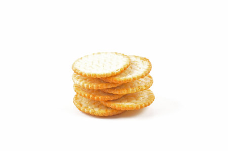 Salty crackers stacked on white backgroundの写真素材