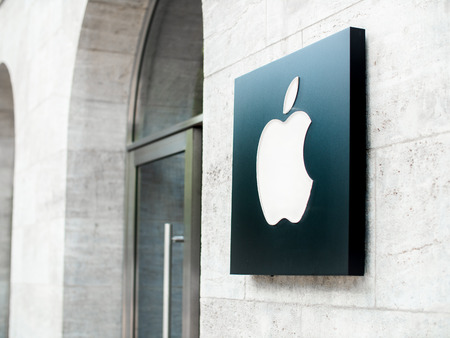 The Apple logo on the front of a flagship Apple store in Berlin, Germanyのeditorial素材