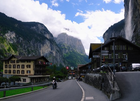 Lauterbrunnen, Switzerland  August 27, 2014  Main Street of Village of Lauterbrunnen in Lauterbrunnen Valley with View of Staubbach Fallsのeditorial素材