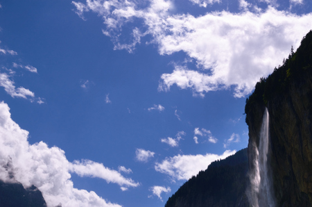 Blue Sky, White Clouds, and Staubbach Falls in Lauterbrunnen Valley (Jungfrau Region, Switzerland)