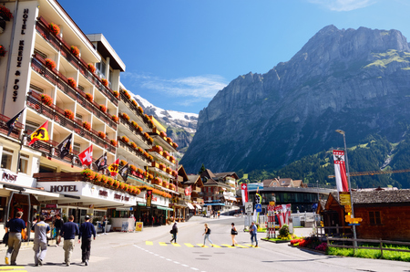 Grindelwald, Switzerland - August 28, 2014 â Mountain Ski Resort Village Grindelwald (Jungfrau Region, Switzerland). Hotel Kreuz & Post; Mountains in the Background.のeditorial素材