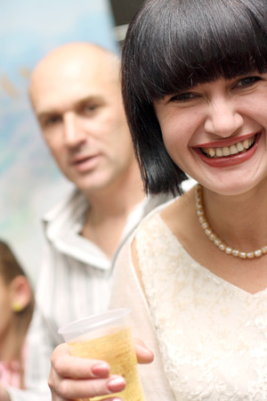 smiling young woman with champagneの写真素材