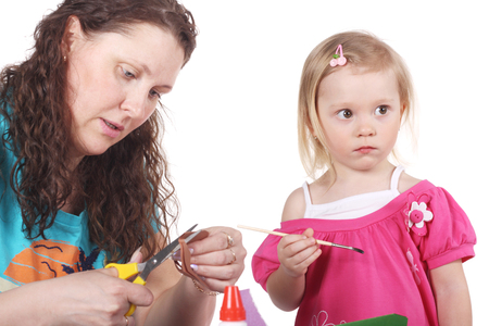 cute little child making applique with her motherの写真素材