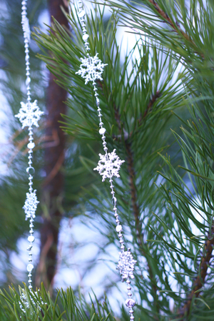 firtree decorated with silver snowflakesの写真素材