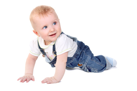 cute little baby creeping and smiling isolated on white