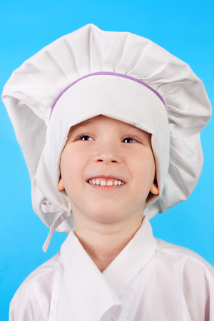 cute smiling little child dressed as a cookの写真素材