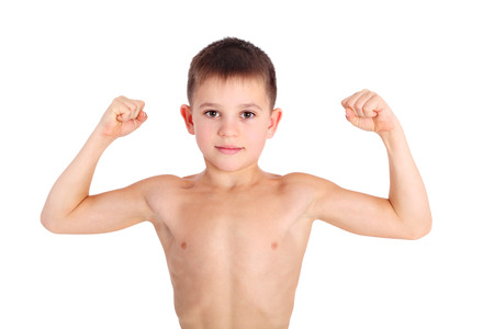 handsome little boy demonstrating his musclesの写真素材